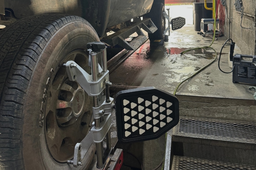 Wheel Alignment In Durango CO At Firestone of Durango. Close-up view of a vehicle during a wheel alignment service.