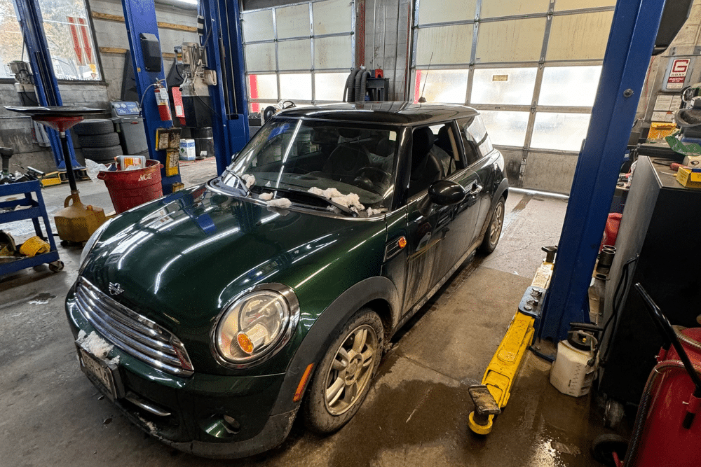Spring Car Safety Check in Durango CO At Firestone of Durango. Car inside an auto repair shop for spring preventive maintenance