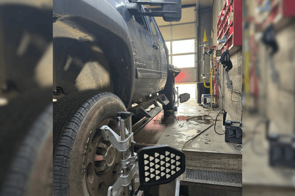 Preventative maintenance, auto repair in Durango, CO, at Firestone of Durango. Heavy-duty pickup truck undergoing a professional wheel alignment with precision alignment equipment attached, ensuring proper tire wear, accurate steering, and improved handling for safe, reliable driving.