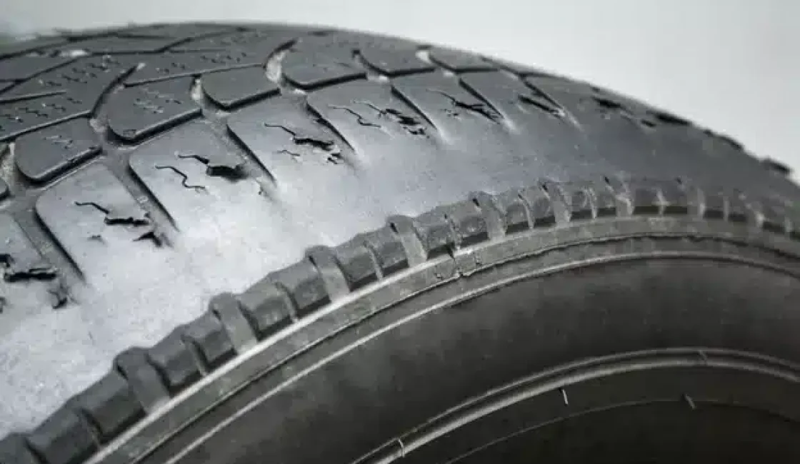 Why fall is the perfect time for tire replacement in Durango, CO with Firestone of Durango. Image of bald and cracked tire.